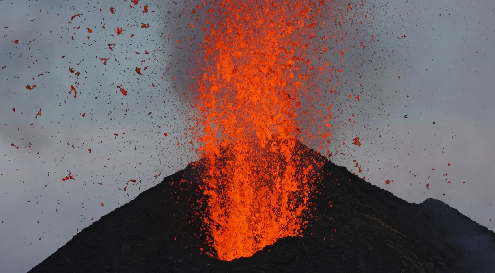 Lava and incandescent rock thrown from a Stromboli crater