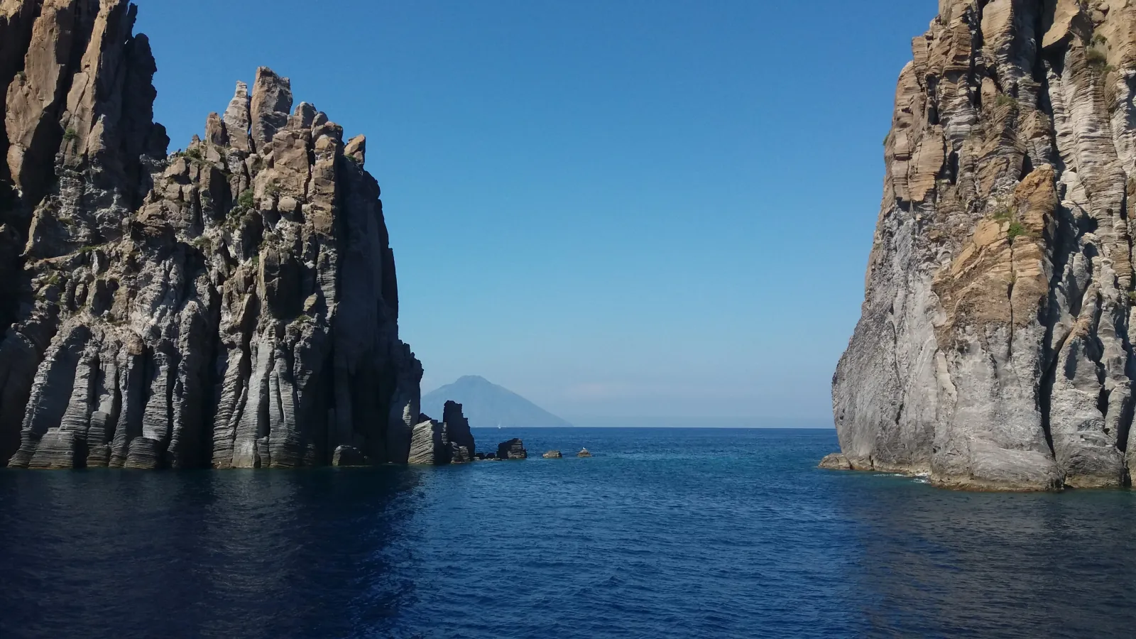 Stromboli between two sea cliffs