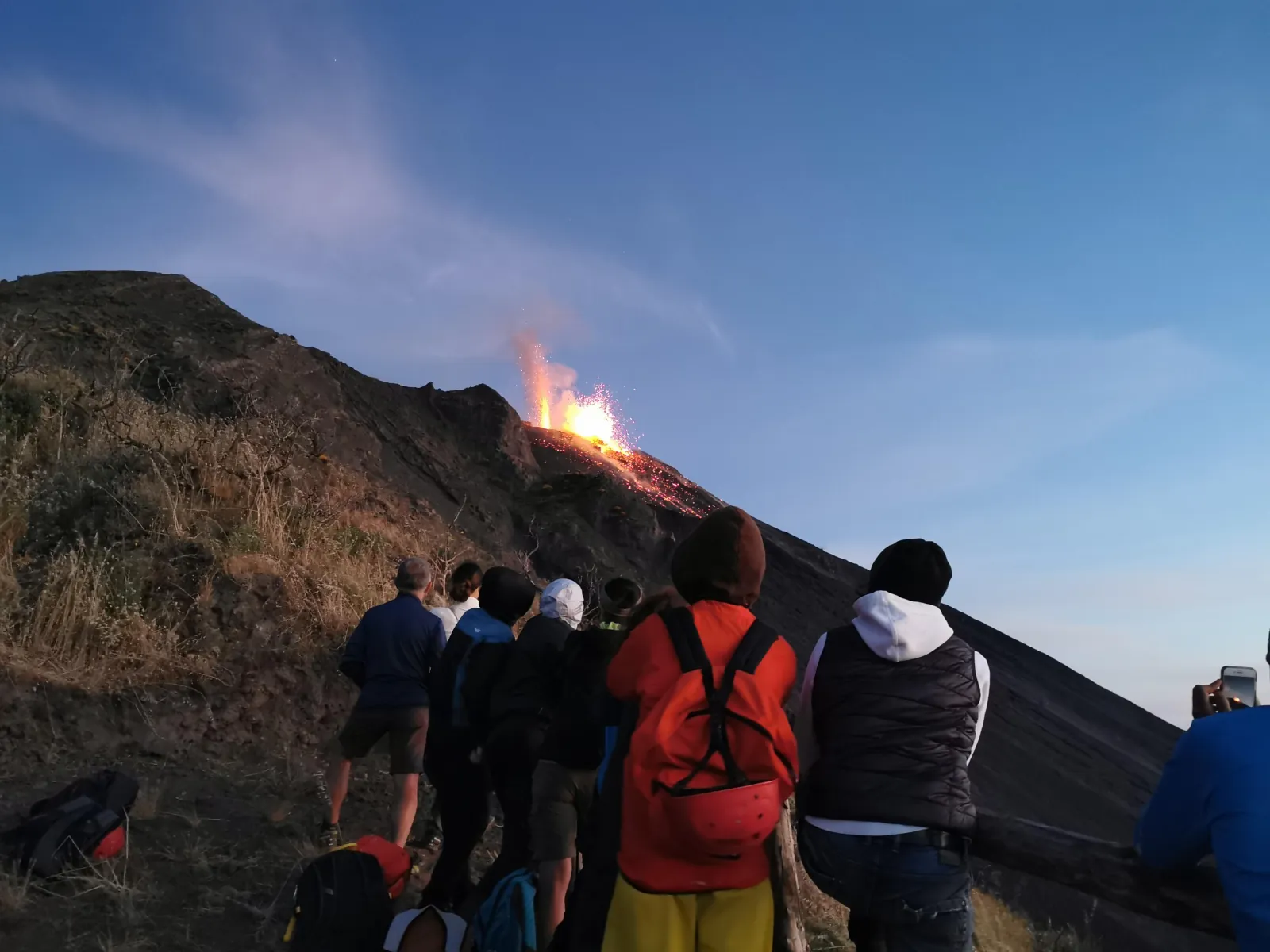Hikers watching an eruption from the 400-metre viewpoint