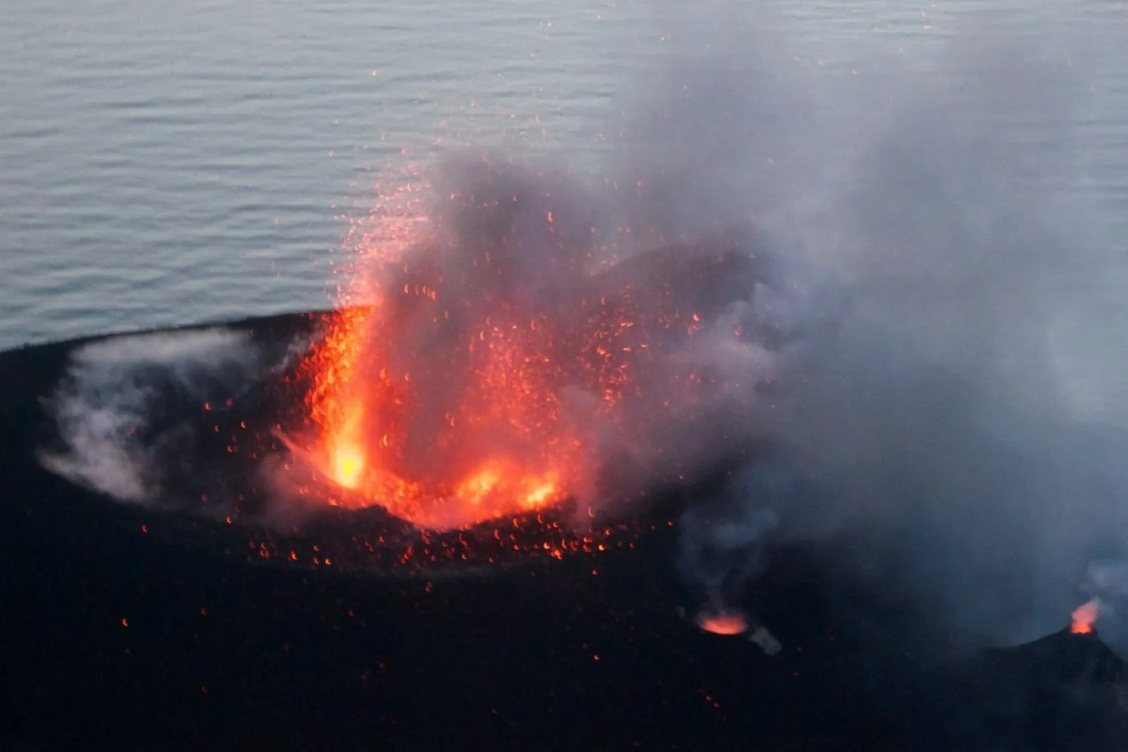 A Stromboli crater erupting at dusk