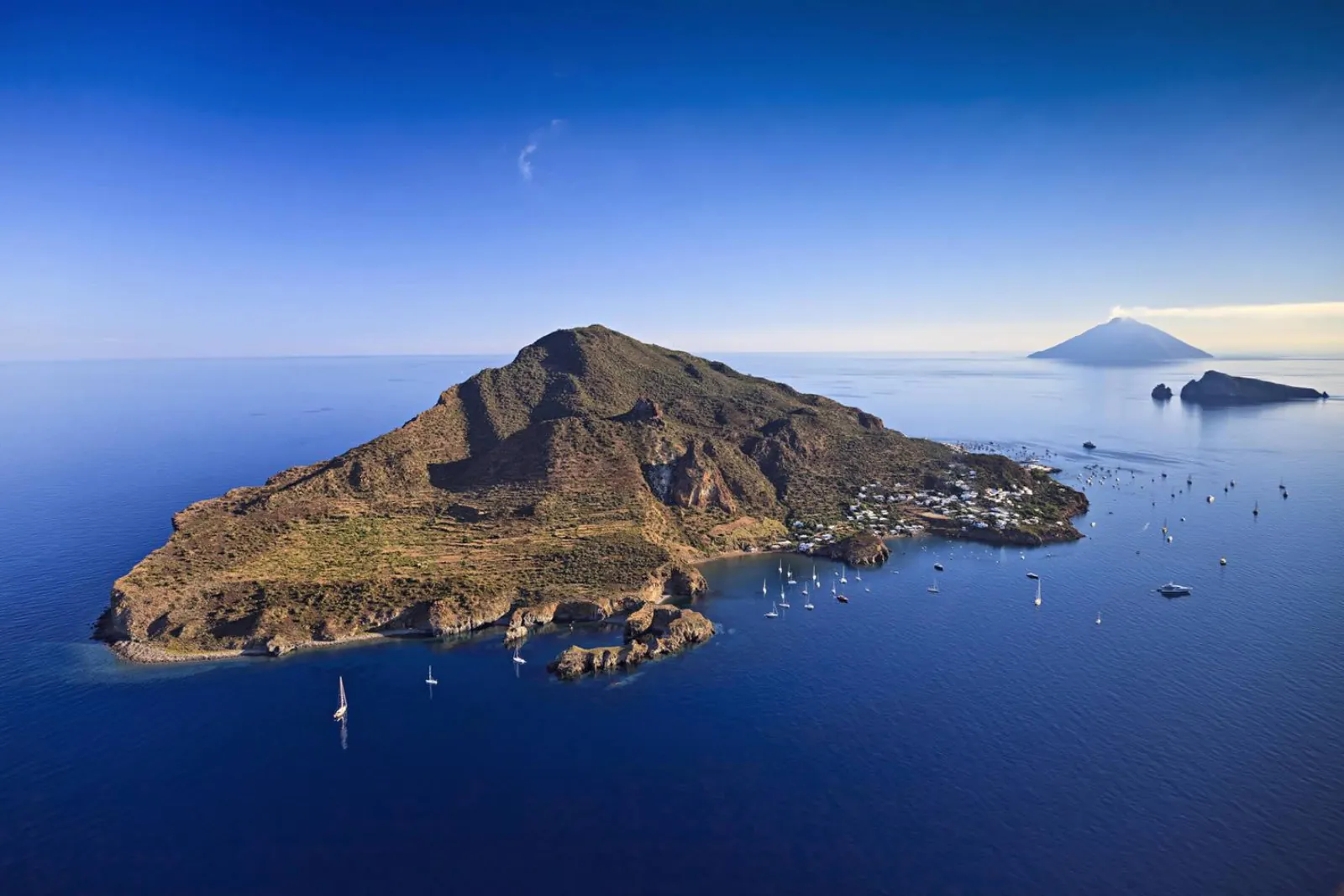 An Aeolian islet from the air with Stromboli on the horizon