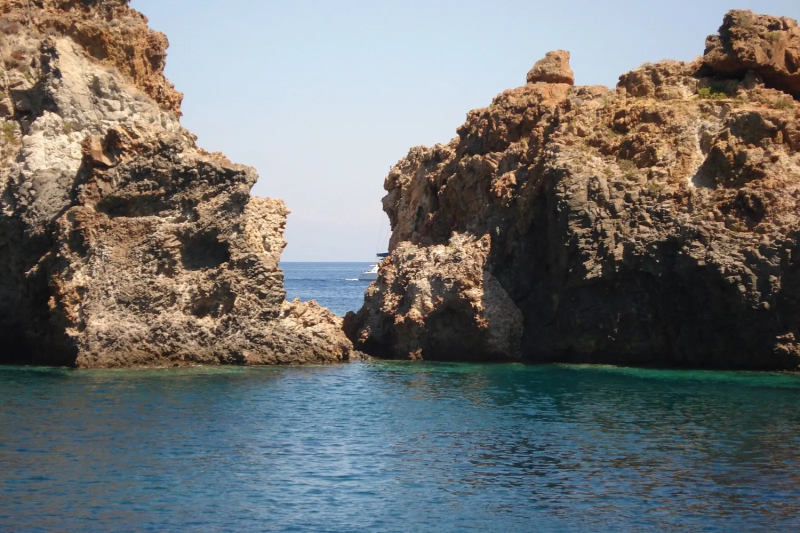 Clear water between two lava sea cliffs