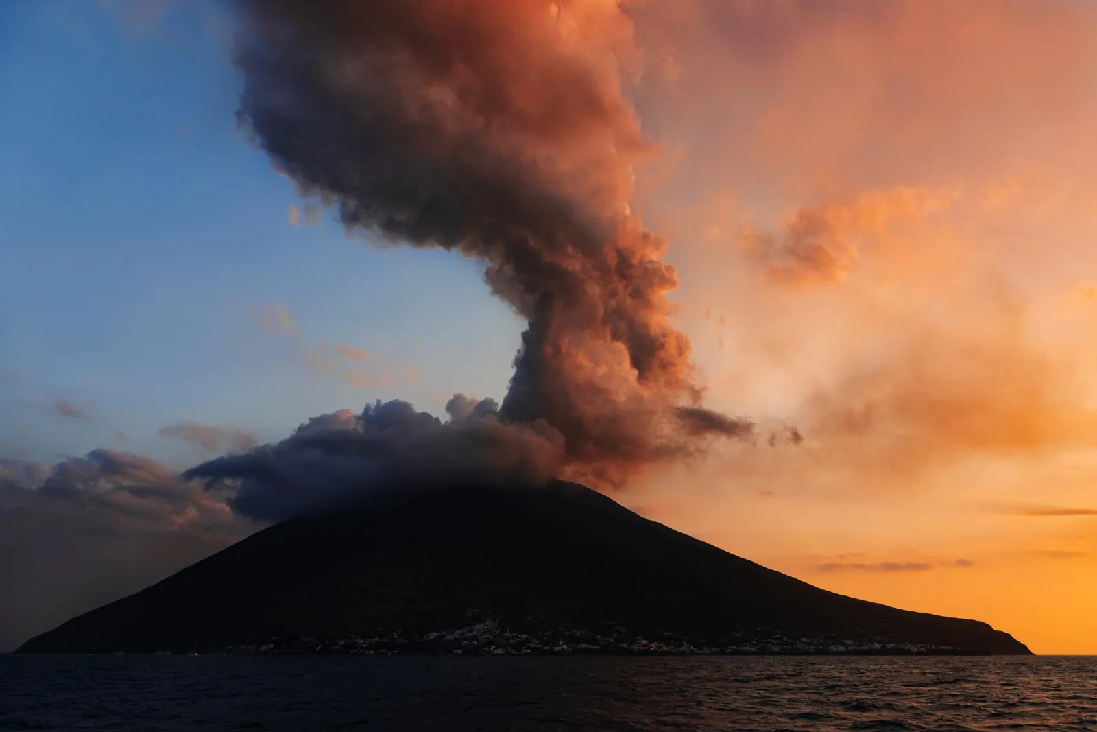 Stromboli's ash plume against a sunset sky
