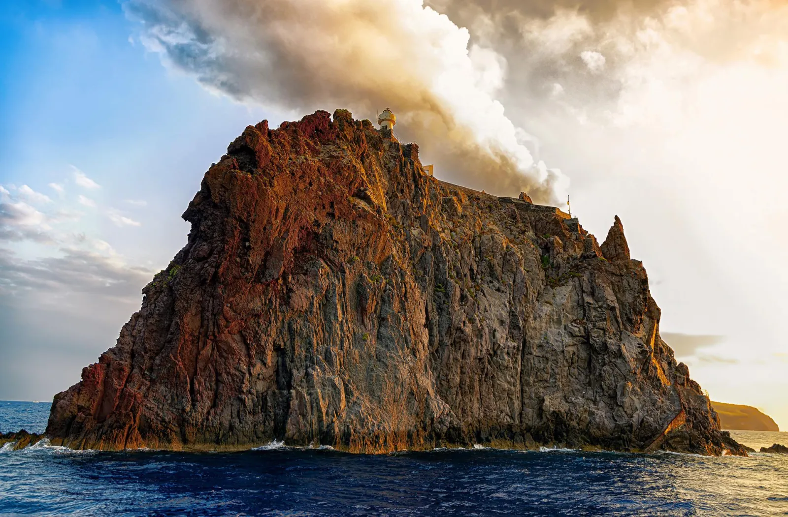 Strombolicchio with Stromboli's plume behind