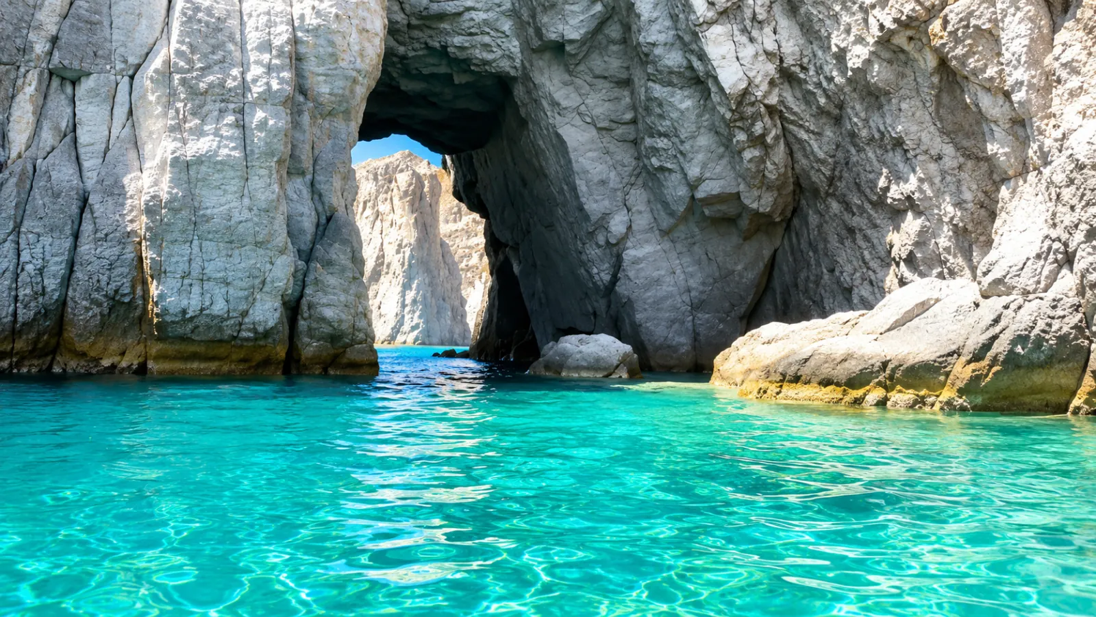 Sea arch above turquoise water off Vulcano