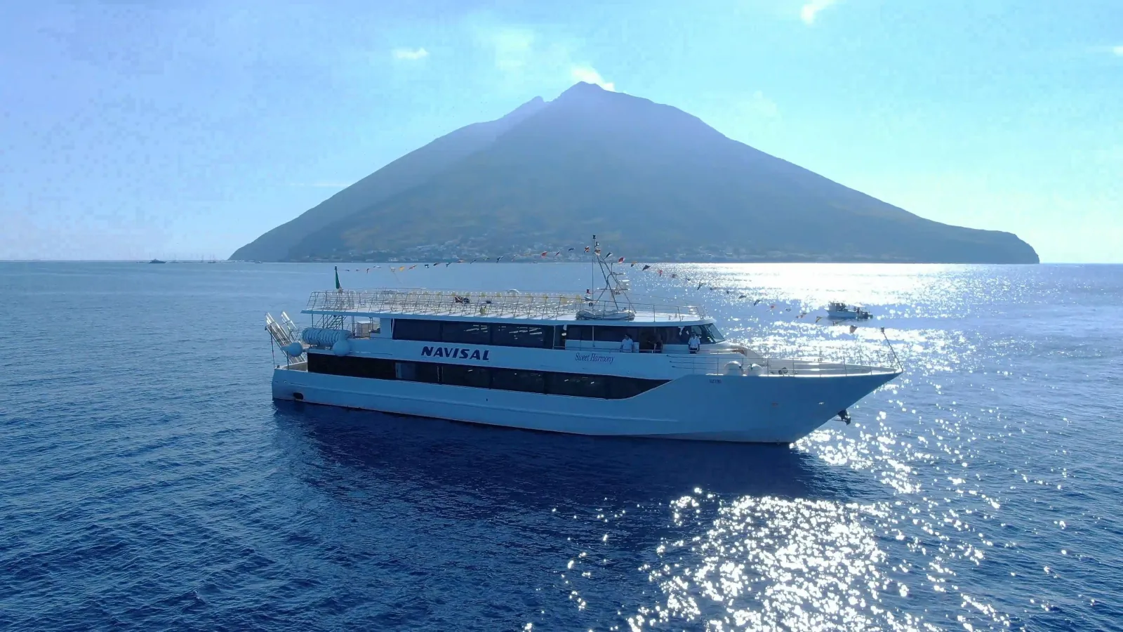 Navisal excursion boat sailing past the cone of Stromboli