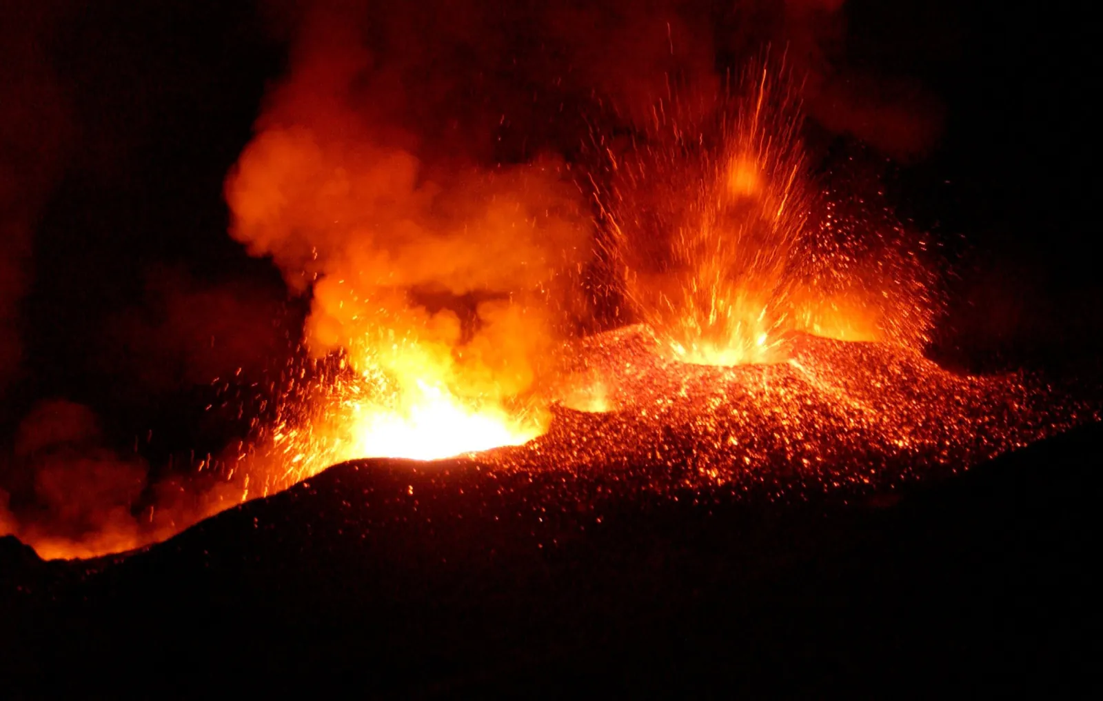 Glowing lava from Stromboli's craters at night