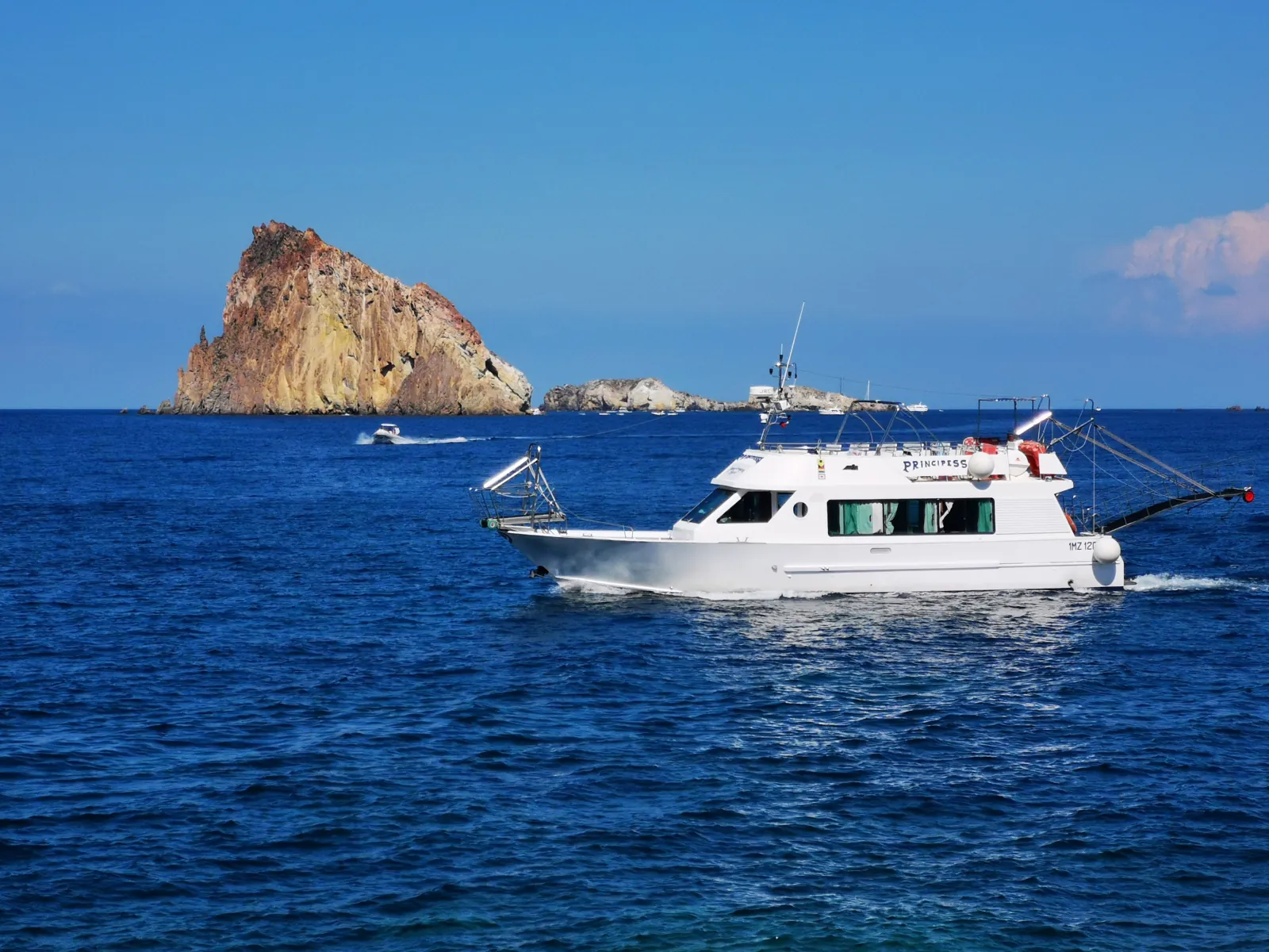 Excursion boat passing Dattilo islet off Panarea