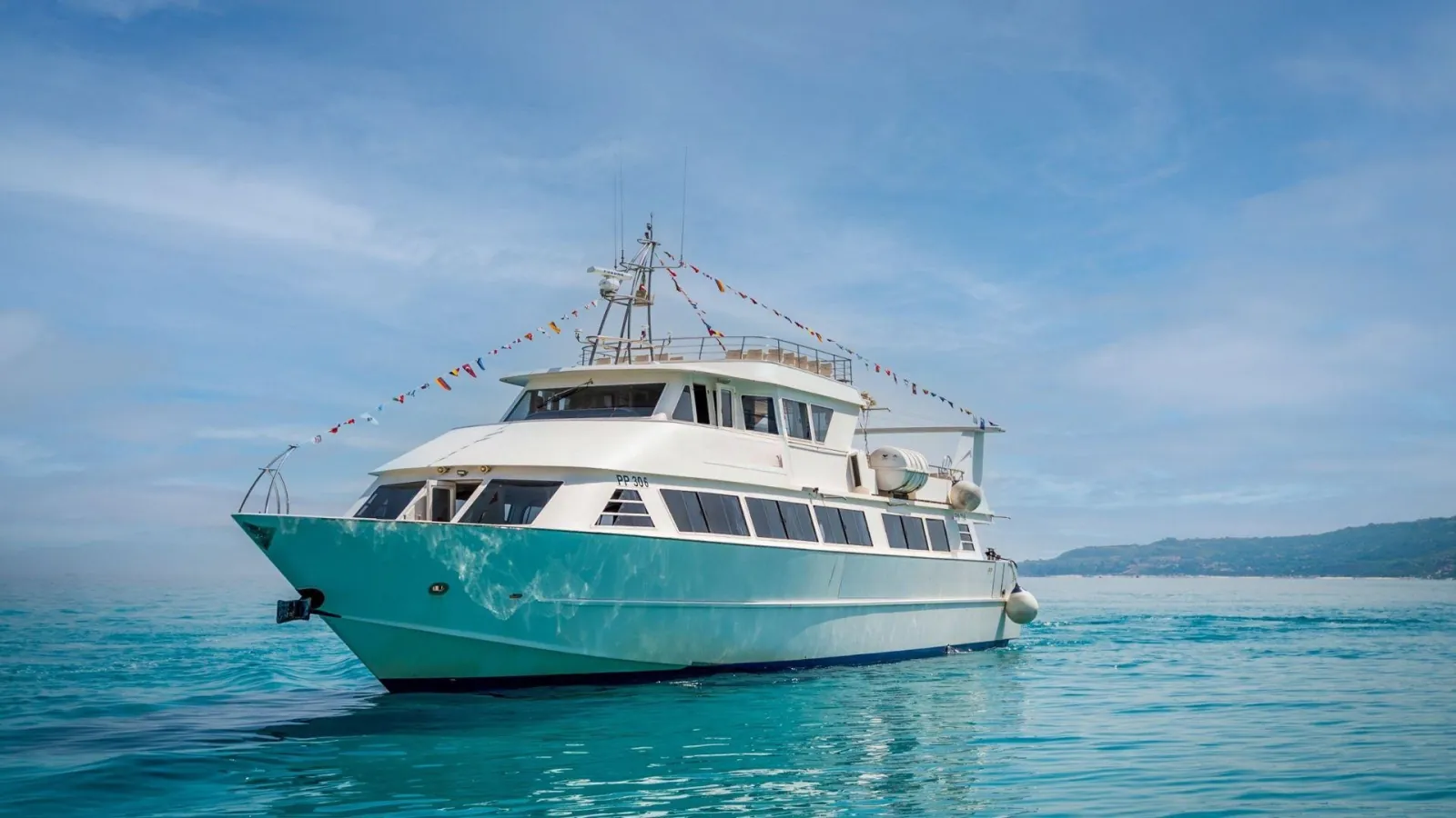 Comerci boat on turquoise water