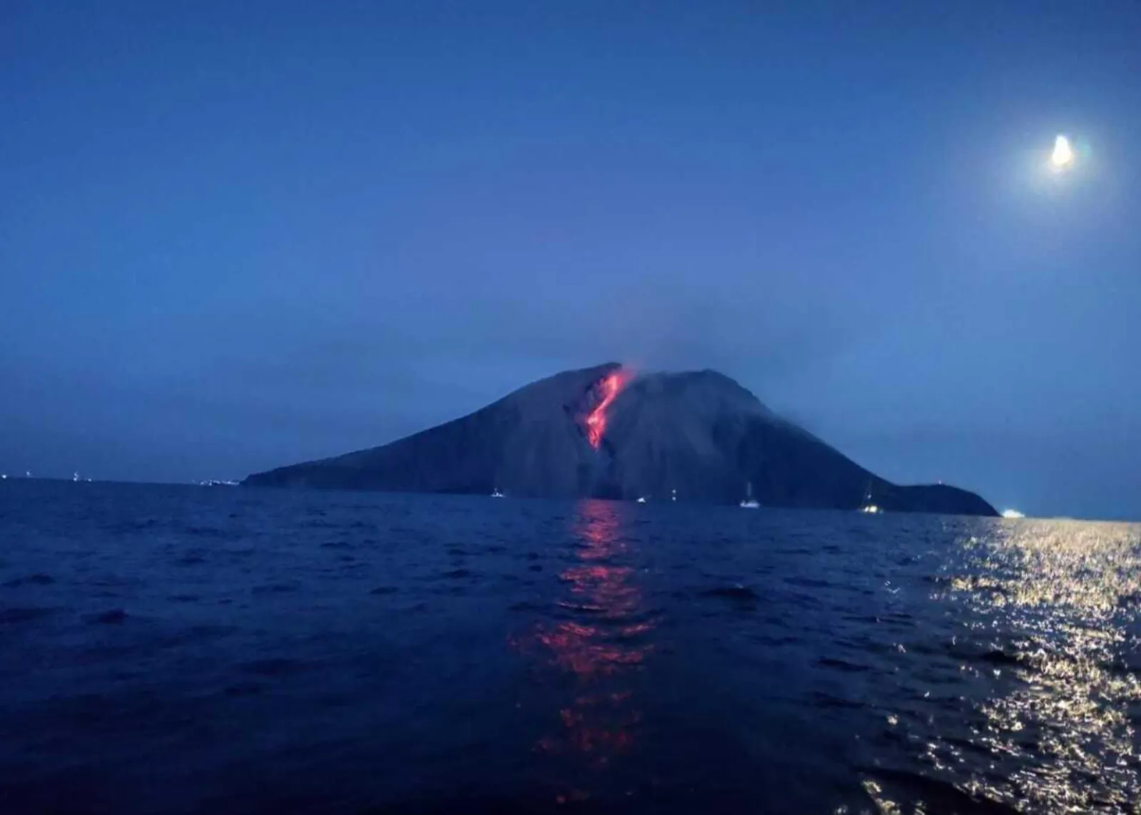Moonlit night with lava glowing on Stromboli's flank