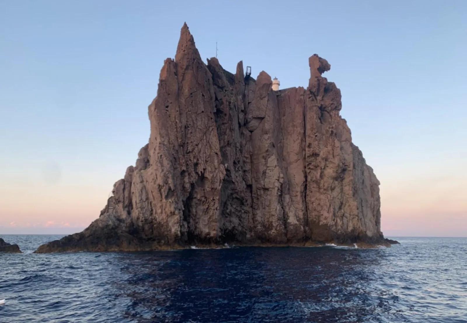Basiluzzo's rocky shore from a small boat