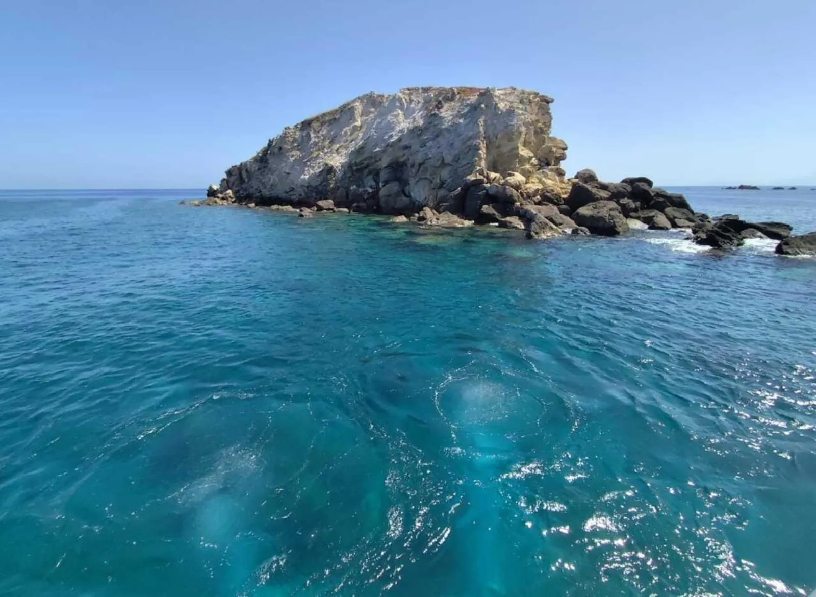 A low rocky islet off Panarea in turquoise water
