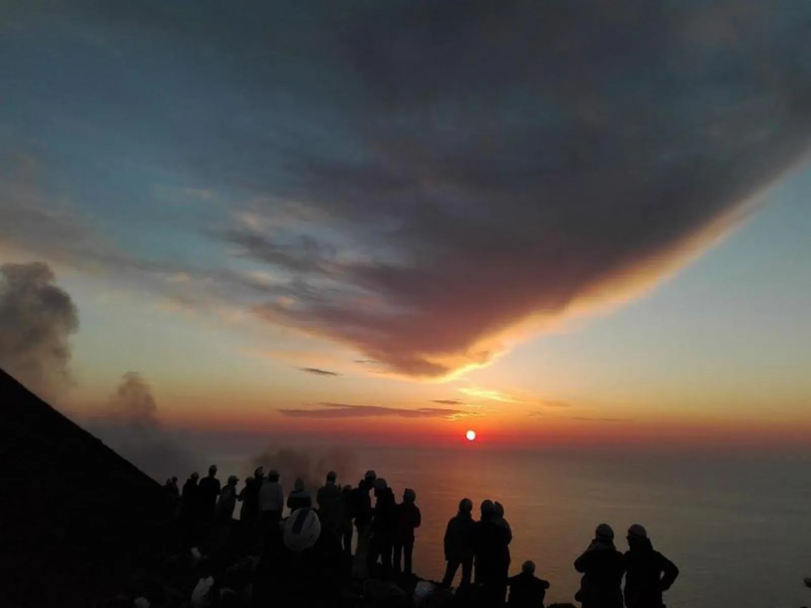 Sunset under a dark cloud from the summit ridge
