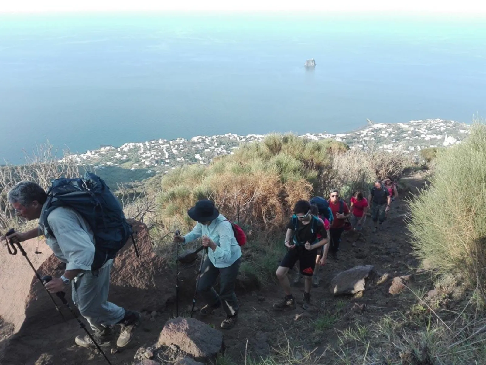 Hikers climbing the path above Stromboli village