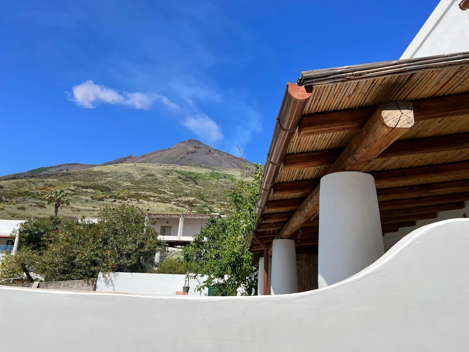Stromboli seen from a whitewashed terrace