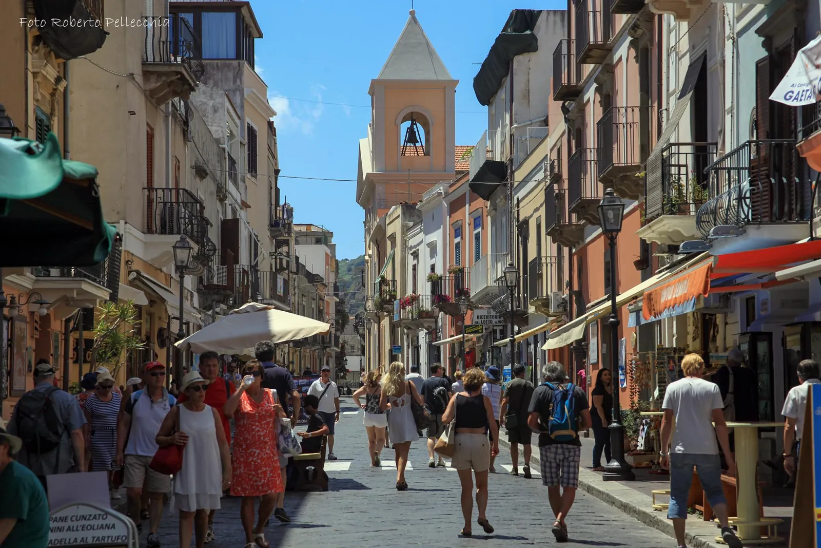 Shoppers on Lipari's main street below the church tower