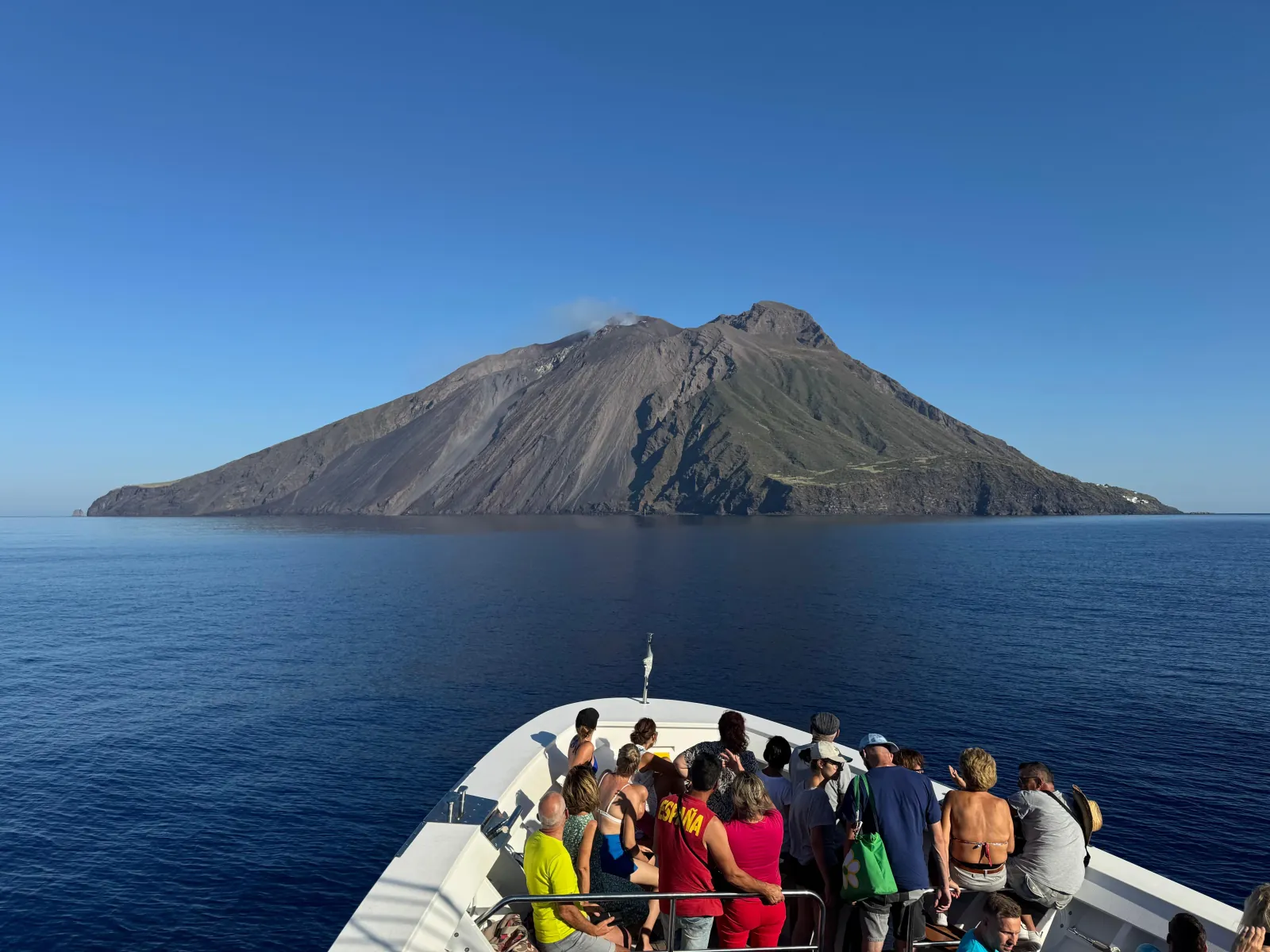 Passengers on the bow as the boat nears Stromboli