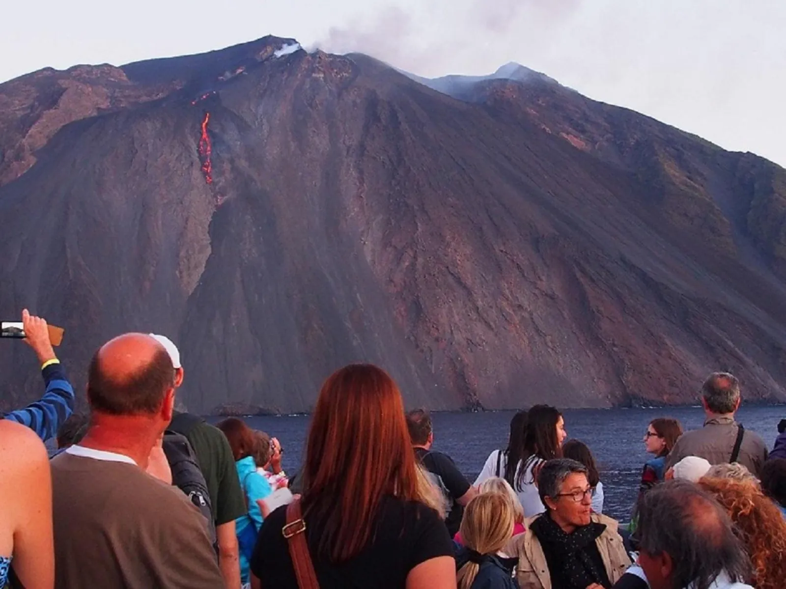 Visitors on Stromboli watching the volcano's flank